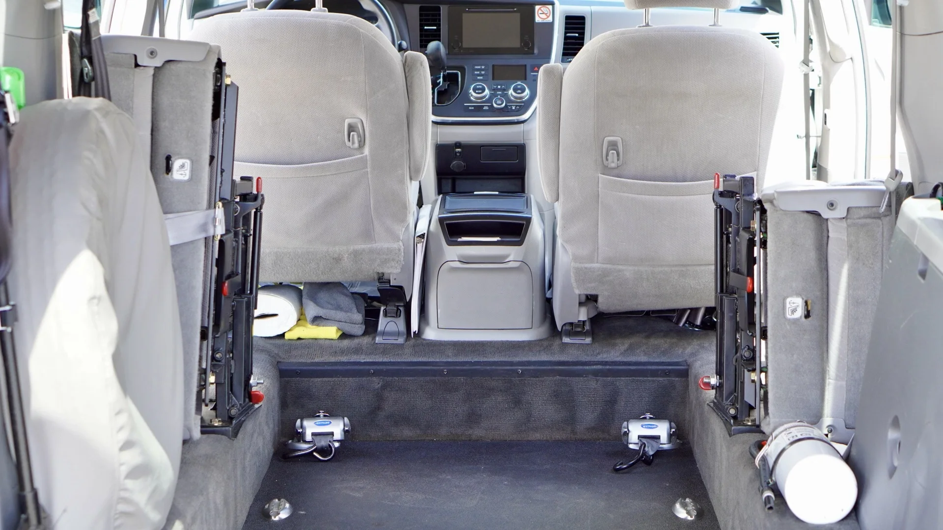 Interior of a Sovereign Medical Transport van showing the wheelchair securement area